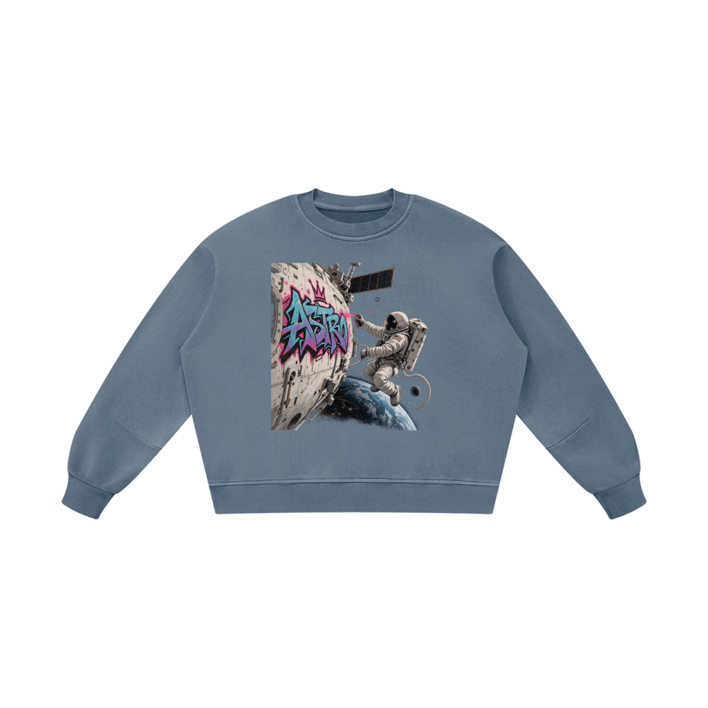 Blue gray ASTRO Space Graffiti boxy vintage-washed sweatshirt, front view with an astronaut and turquoise and pink spacecraft tag.