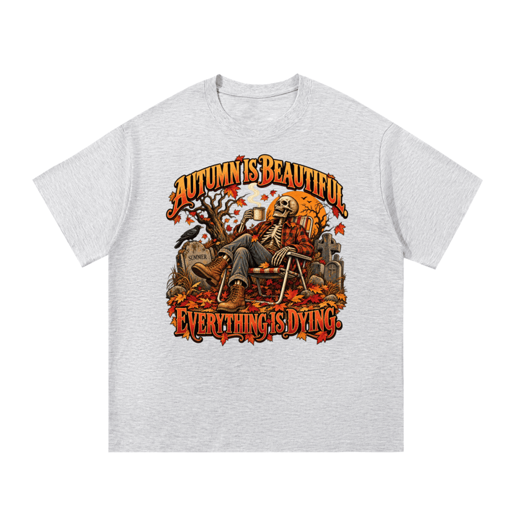 Light gray Autumn Is Beautiful T-shirt, front view with a seated skeleton, fall leaves and "Everything Is Dying" lettering.