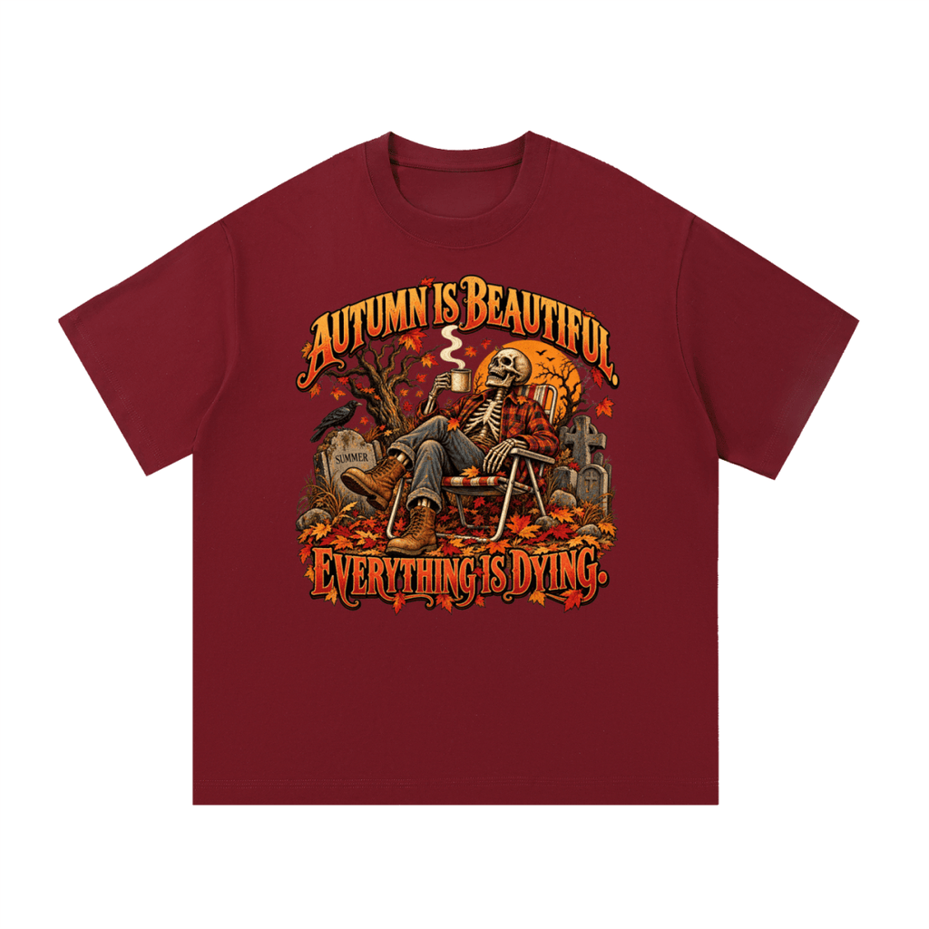 Burgundy Autumn Is Beautiful T-shirt, front view with a seated skeleton, fall leaves and "Everything Is Dying" lettering.