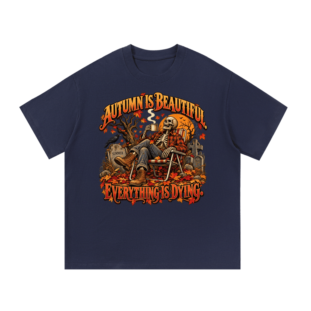 Navy blue Autumn Is Beautiful T-shirt, front view with a seated skeleton, fall leaves and "Everything Is Dying" lettering.