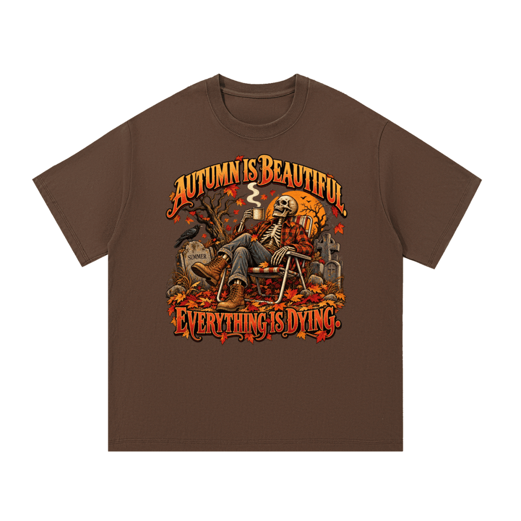 Brown Autumn Is Beautiful T-shirt, front view with a seated skeleton, fall leaves and "Everything Is Dying" lettering.