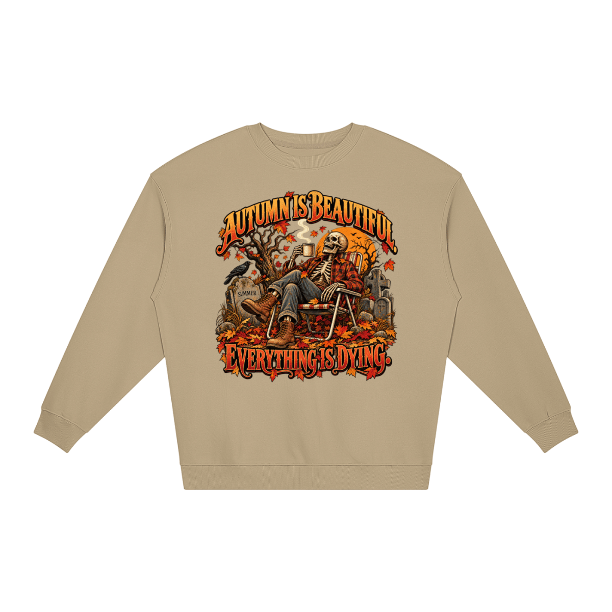 Khaki Autumn Is Beautiful Everything Is Dying loose crewneck sweatshirt, front view with a seated skeleton surrounded by autumn leaves beneath Autumn Is Beautiful Everything Is Dying lettering.