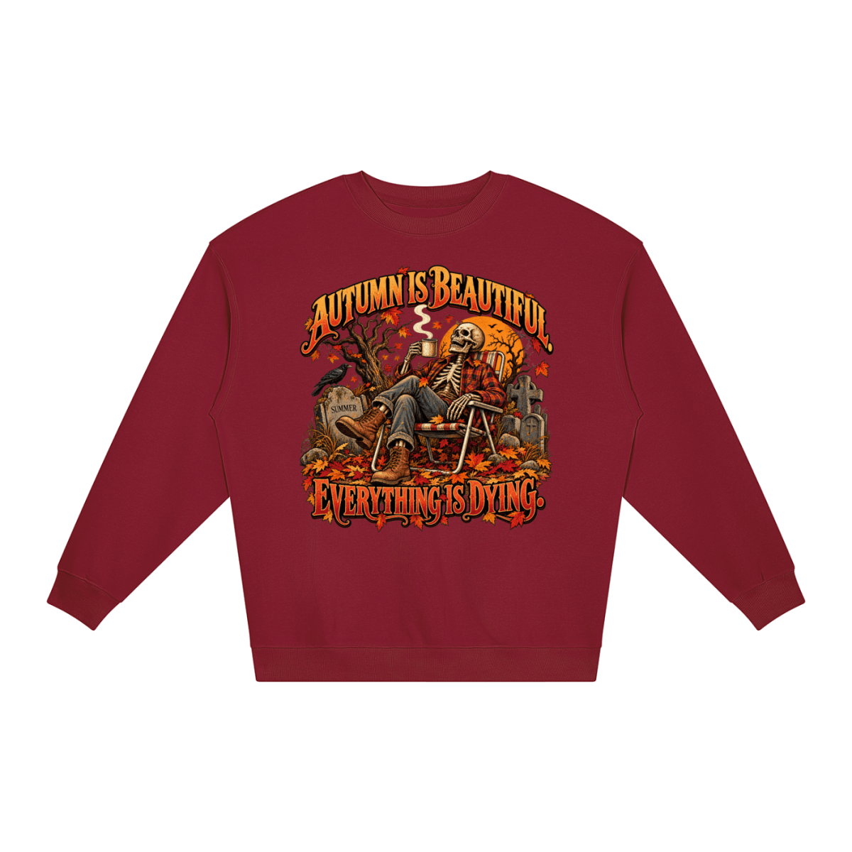 Burgundy Autumn Is Beautiful Everything Is Dying loose crewneck sweatshirt, front view with a seated skeleton surrounded by autumn leaves beneath Autumn Is Beautiful Everything Is Dying lettering.