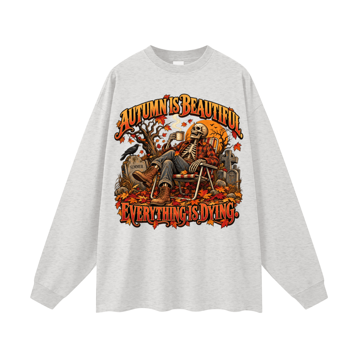 Light gray Autumn Is Beautiful long-sleeve T-shirt, front view with a seated skeleton, fall leaves and orange lettering.