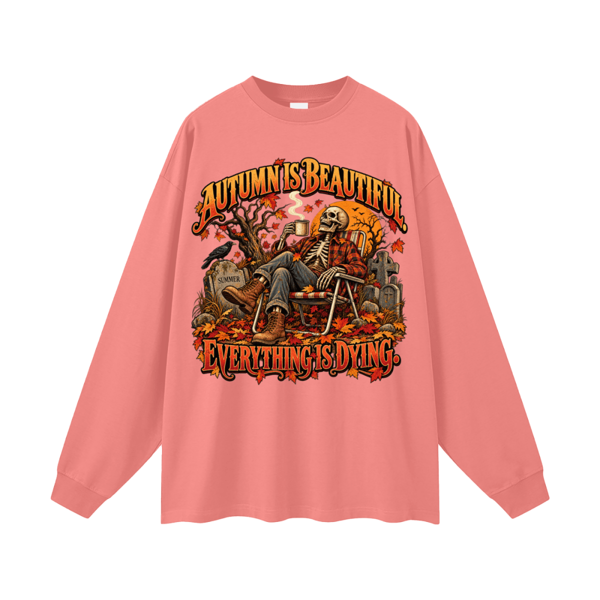 Coral pink Autumn Is Beautiful long-sleeve T-shirt, front view with a seated skeleton, fall leaves and orange lettering.
