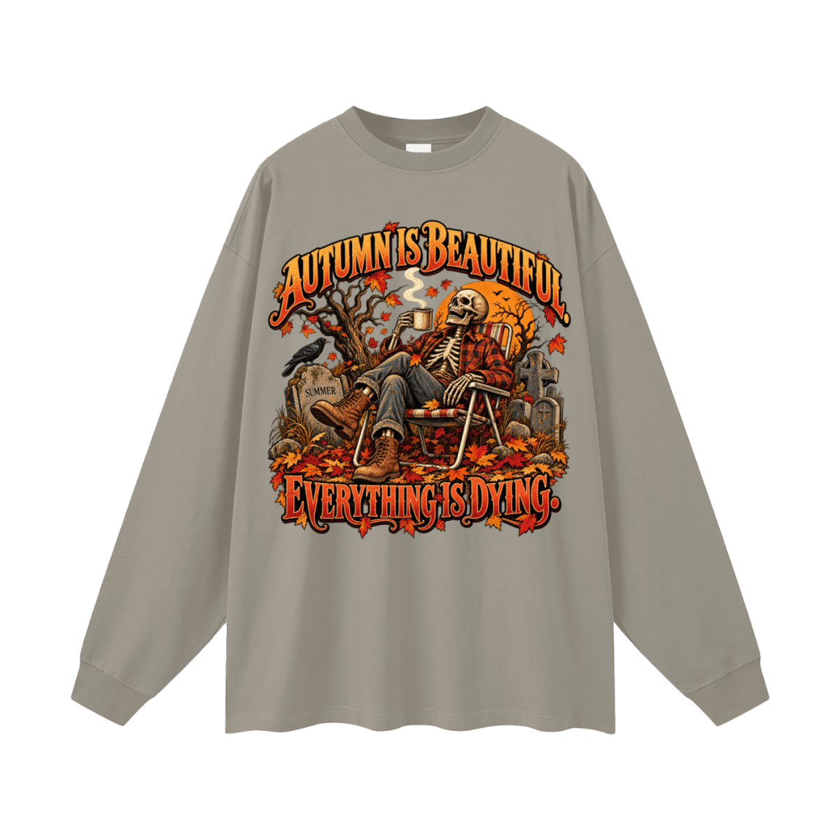 Taupe gray Autumn Is Beautiful long-sleeve T-shirt, front view with a seated skeleton, fall leaves and orange lettering.