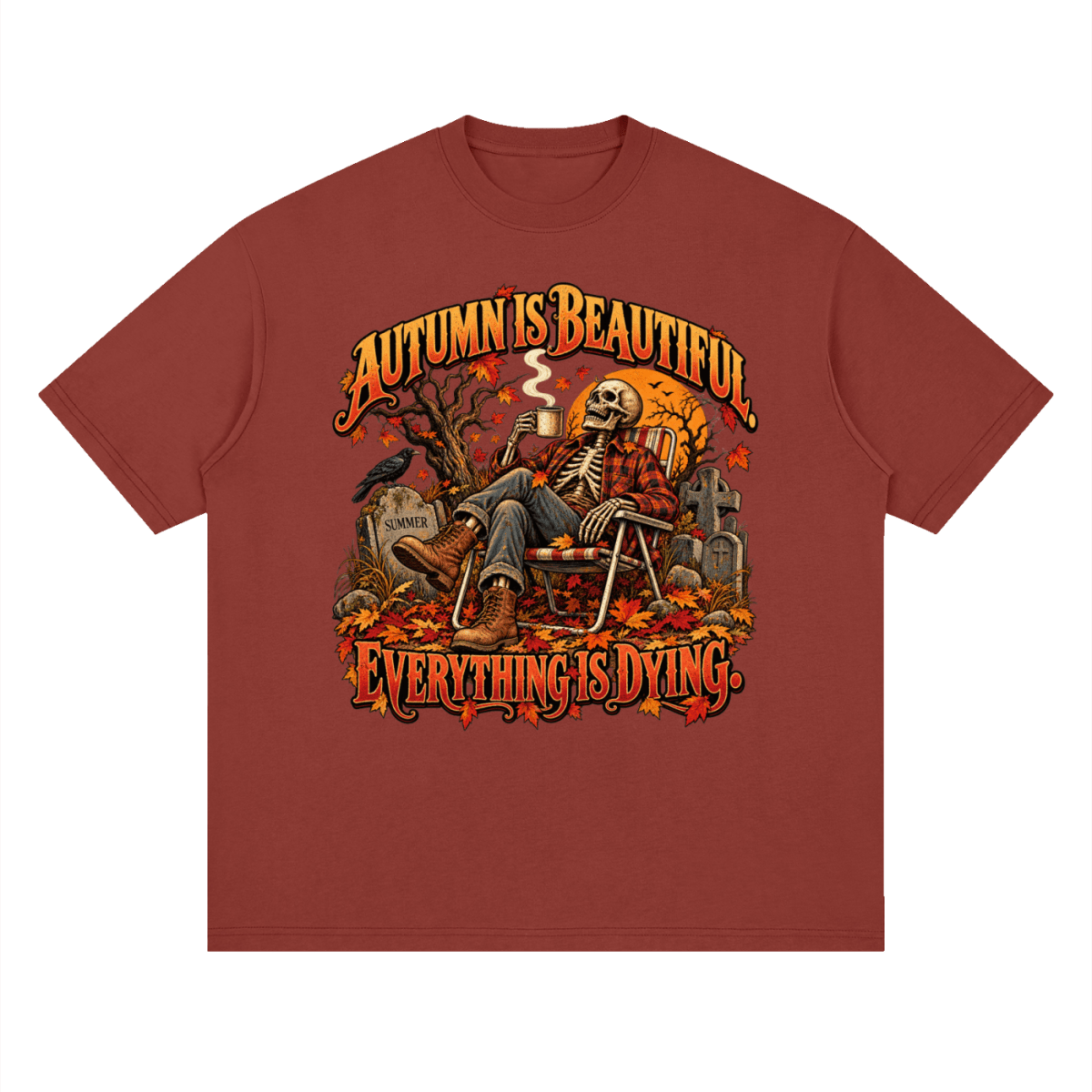 Rust red Autumn Is Beautiful drop-shoulder T-shirt, front view with a seated skeleton, fall leaves and orange lettering.