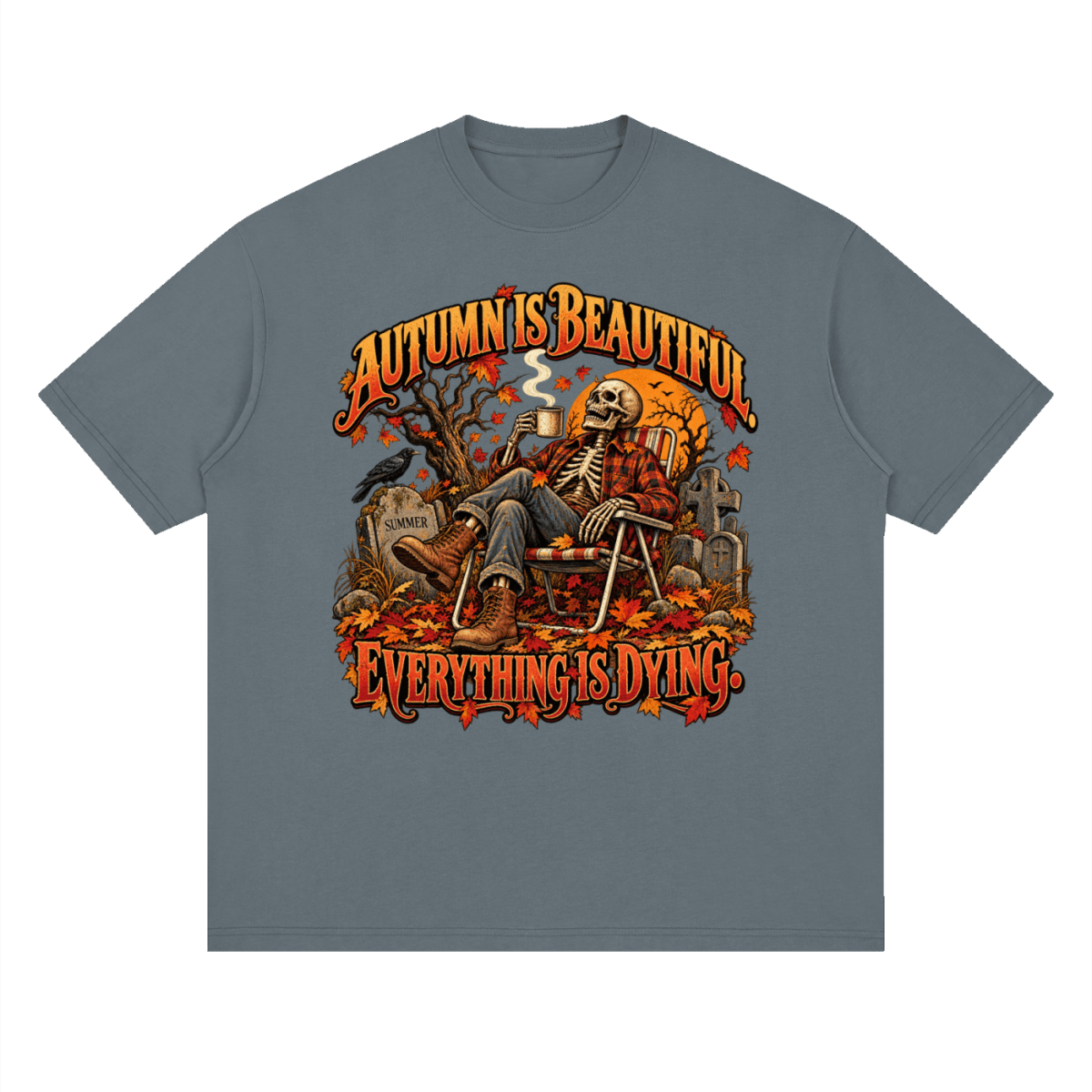 Slate gray Autumn Is Beautiful drop-shoulder T-shirt, front view with a seated skeleton, fall leaves and orange lettering.