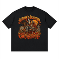 Black Autumn Is Beautiful drop-shoulder T-shirt, front view with a seated skeleton, fall leaves and orange lettering.