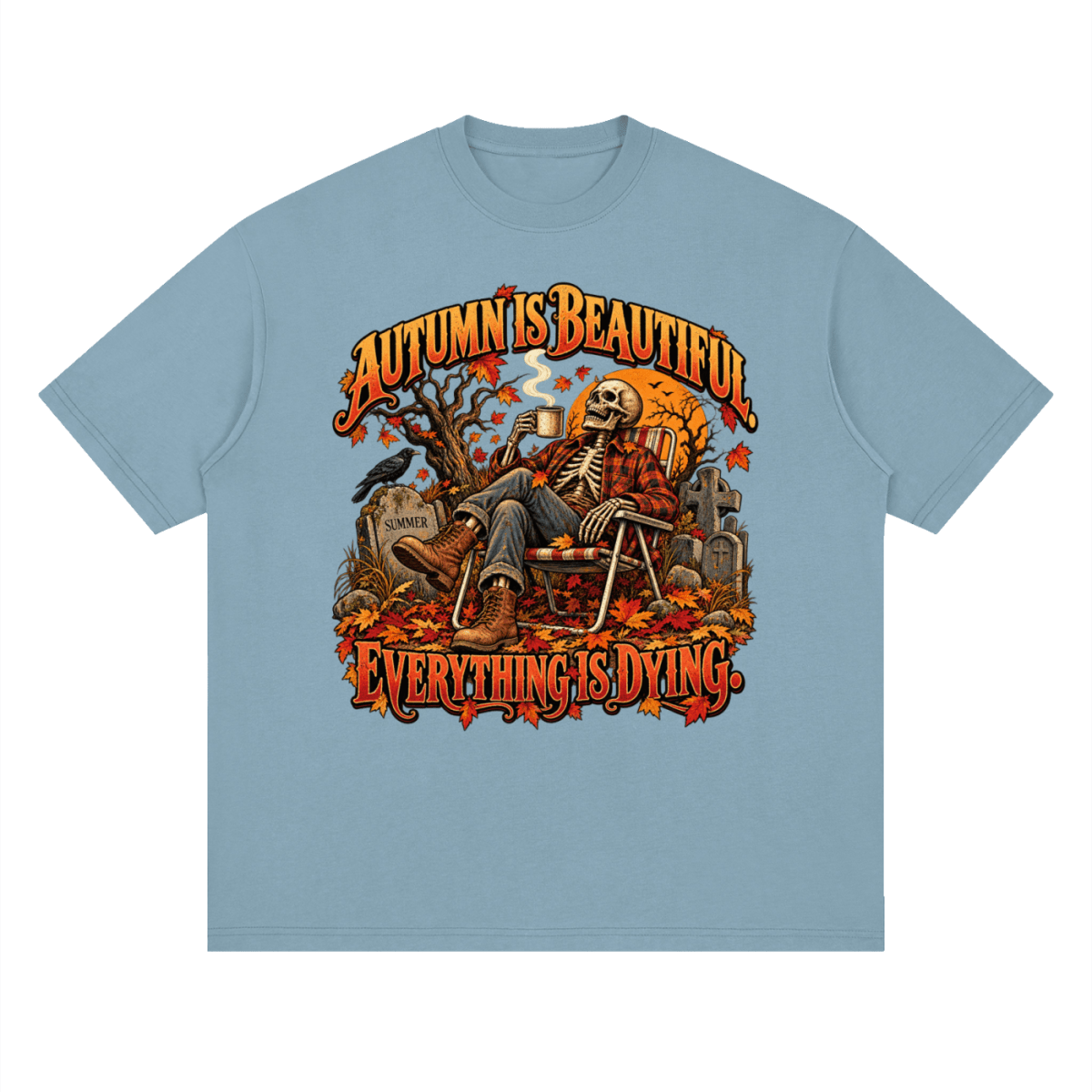 Muted blue Autumn Is Beautiful drop-shoulder T-shirt, front view with a seated skeleton, fall leaves and orange lettering.