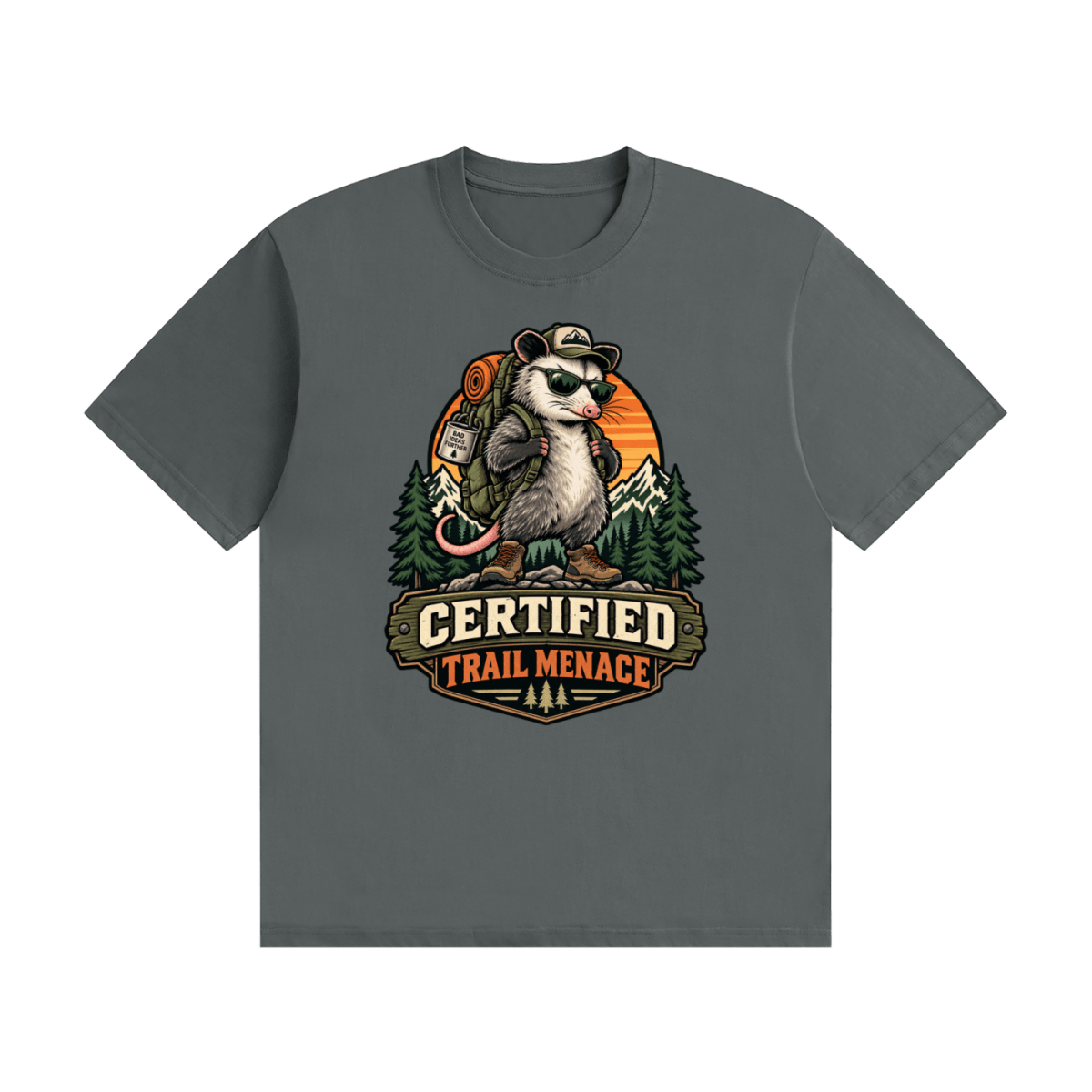 Dark gray cotton T-shirt, front view with a hiking possum with sunglasses and backpack against mountains and an orange sunset.