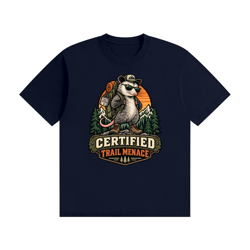 Navy blue cotton T-shirt, front view with a hiking possum with sunglasses and backpack against mountains and an orange sunset.