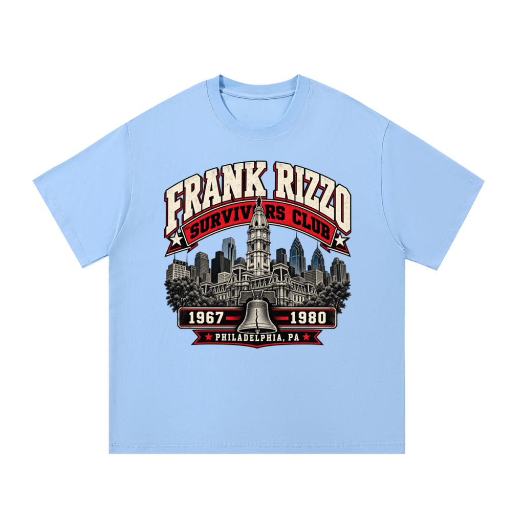 Light blue Frank Rizzo Survivors Club T-shirt, front view with a Philadelphia skyline, bell and red and cream Survivors Club lettering.