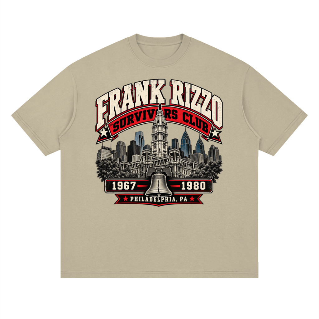 Khaki Frank Rizzo Survivors Club drop-shoulder T-shirt, front view with a Philadelphia skyline, bell and red and cream Survivors Club lettering.