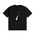 Black cotton T-shirt, front view with a black-and-white nun carrying an oversized multi-barrel gun.