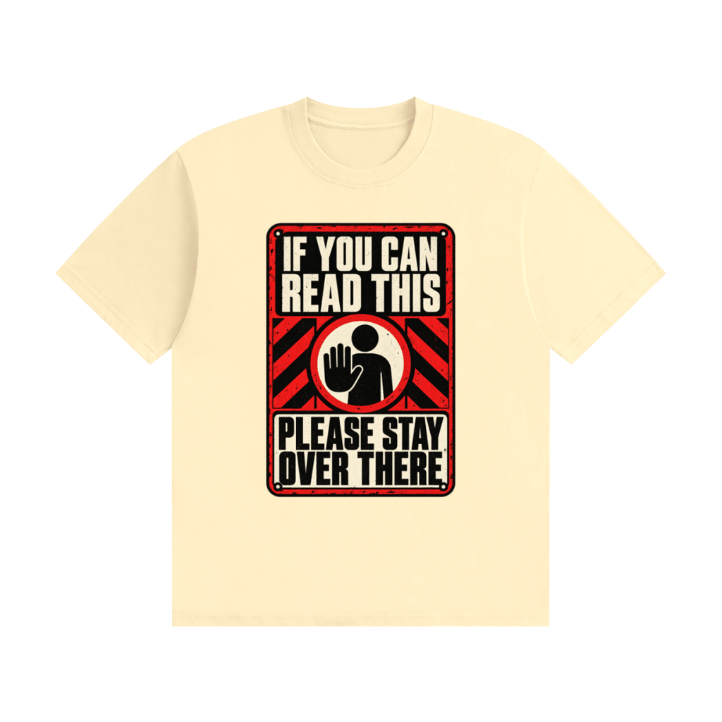 Cream cotton T-shirt, front view with a red-and-cream warning sign reading If You Can Read This Please Stay Over There.