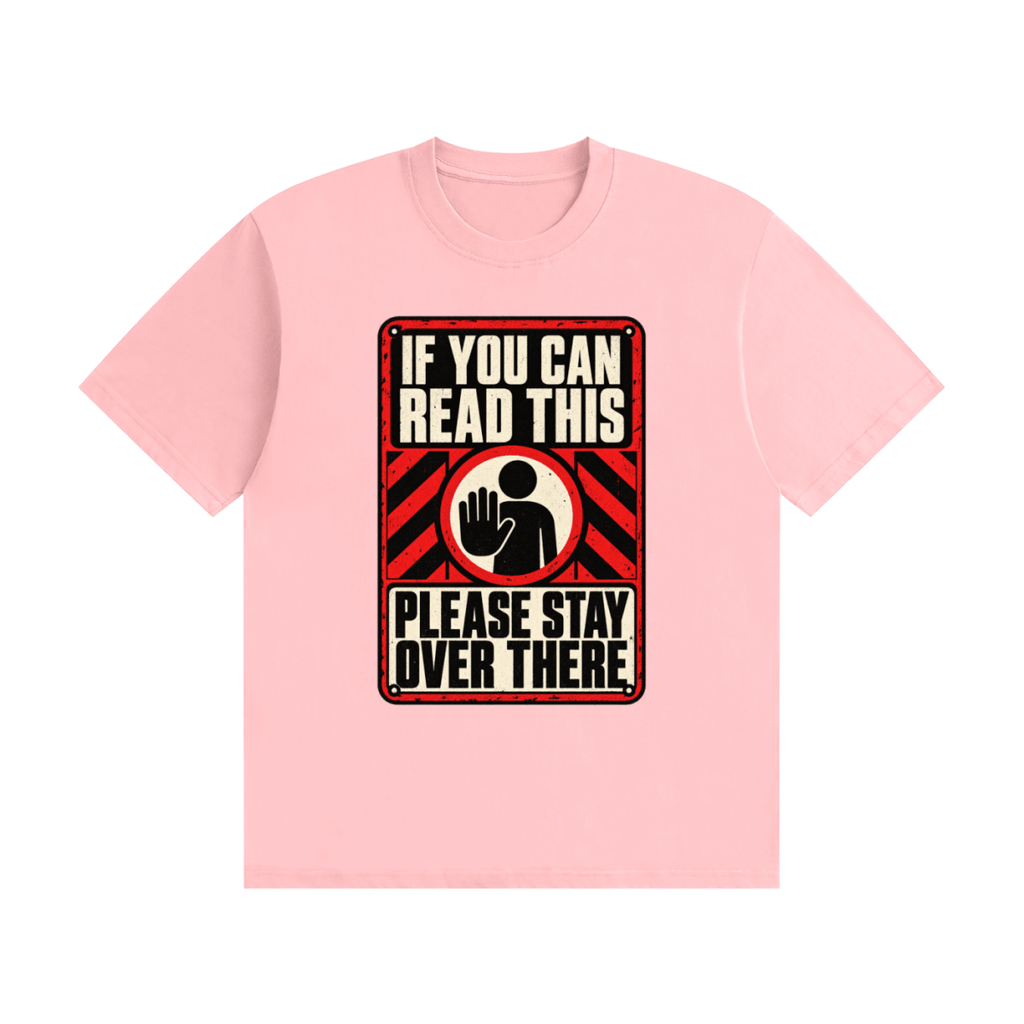 Pink cotton T-shirt, front view with a red-and-cream warning sign reading If You Can Read This Please Stay Over There.
