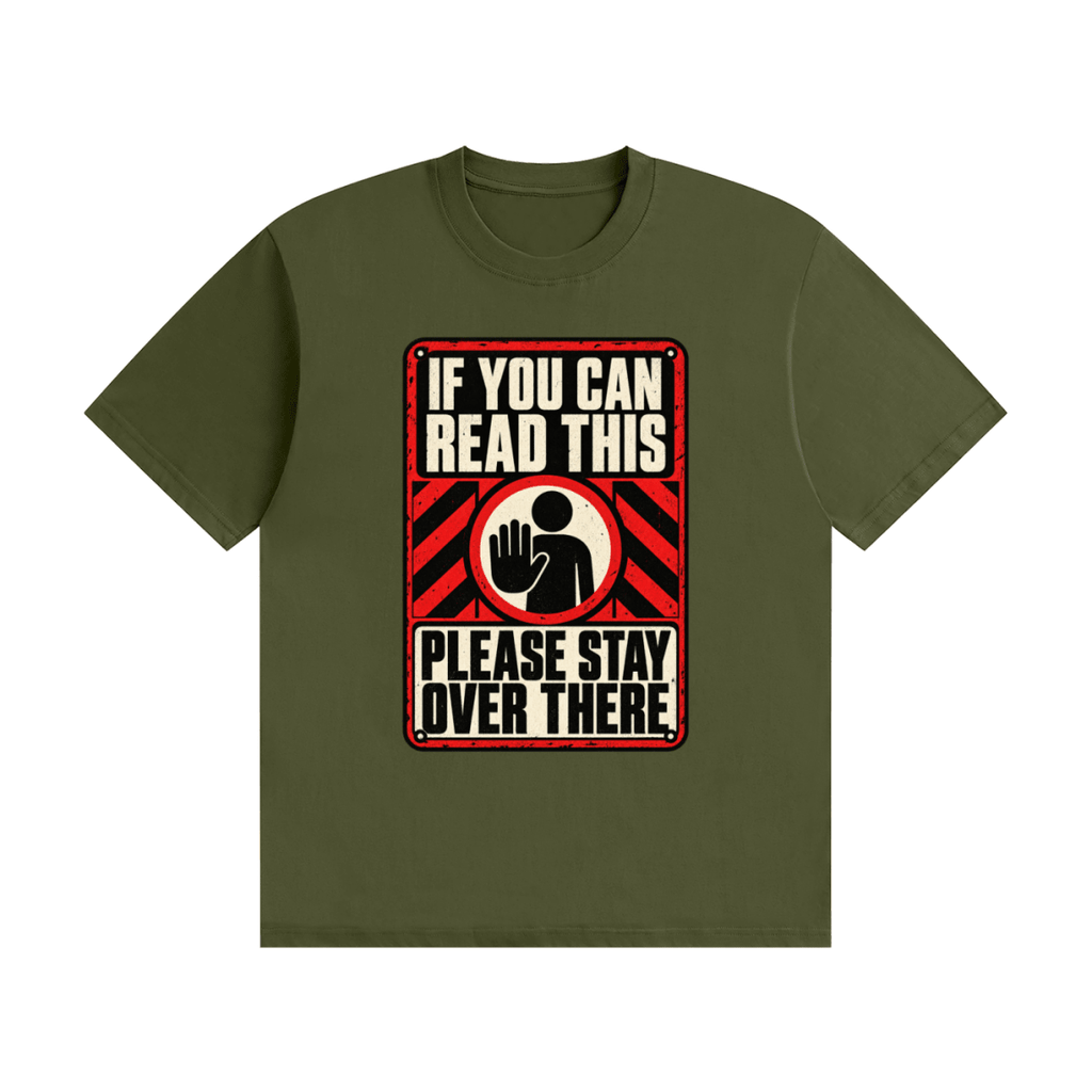 Olive green cotton T-shirt, front view with a red-and-cream warning sign reading If You Can Read This Please Stay Over There.