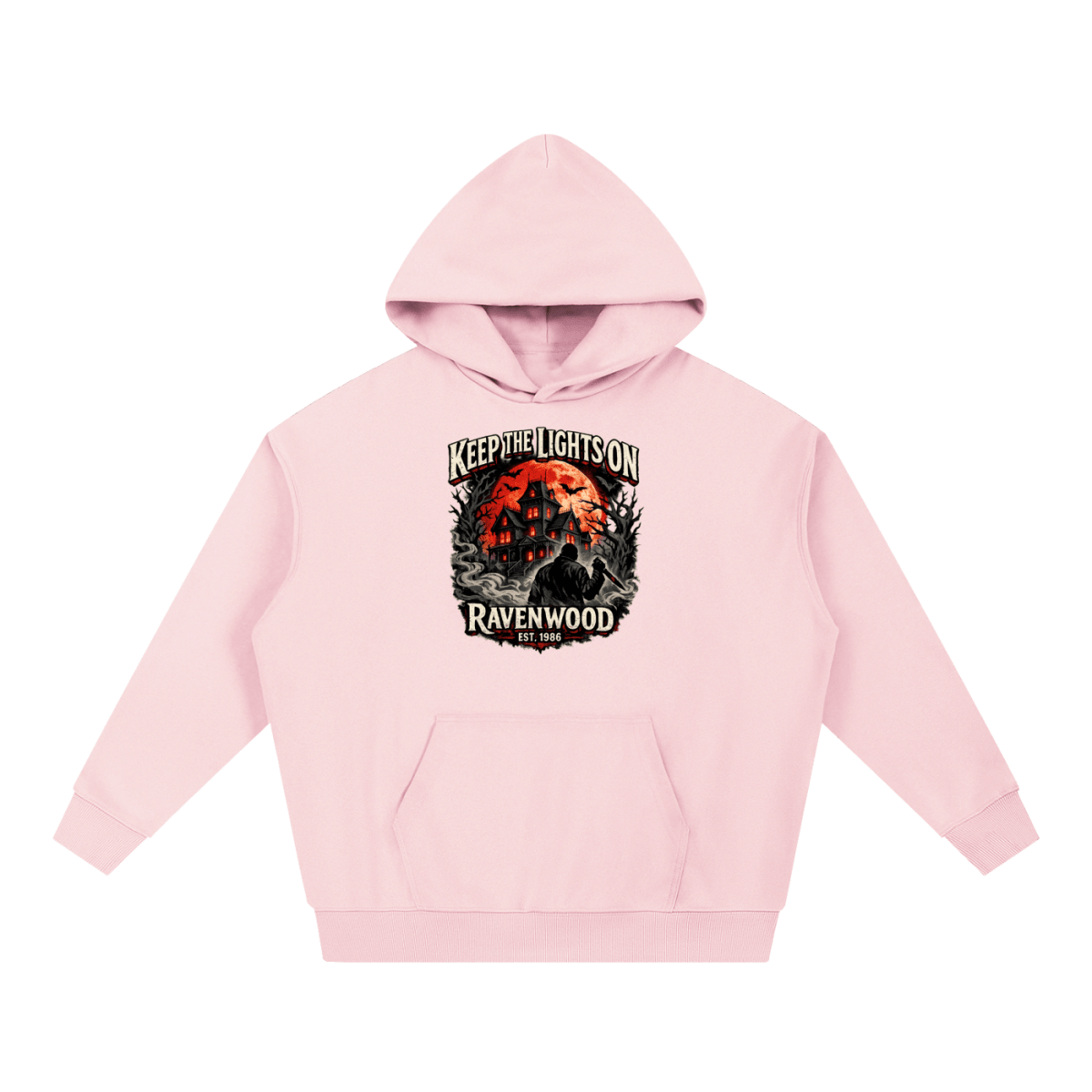 Pink heavyweight hoodie, front view with a haunted house, orange moon and knife-holding silhouette with Keep the Lights On and Ravenwood Est. 1986 lettering.