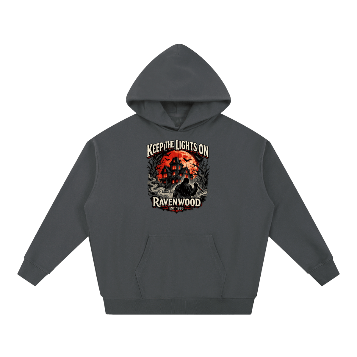Charcoal heavyweight hoodie, front view with a haunted house, orange moon and knife-holding silhouette with Keep the Lights On and Ravenwood Est. 1986 lettering.