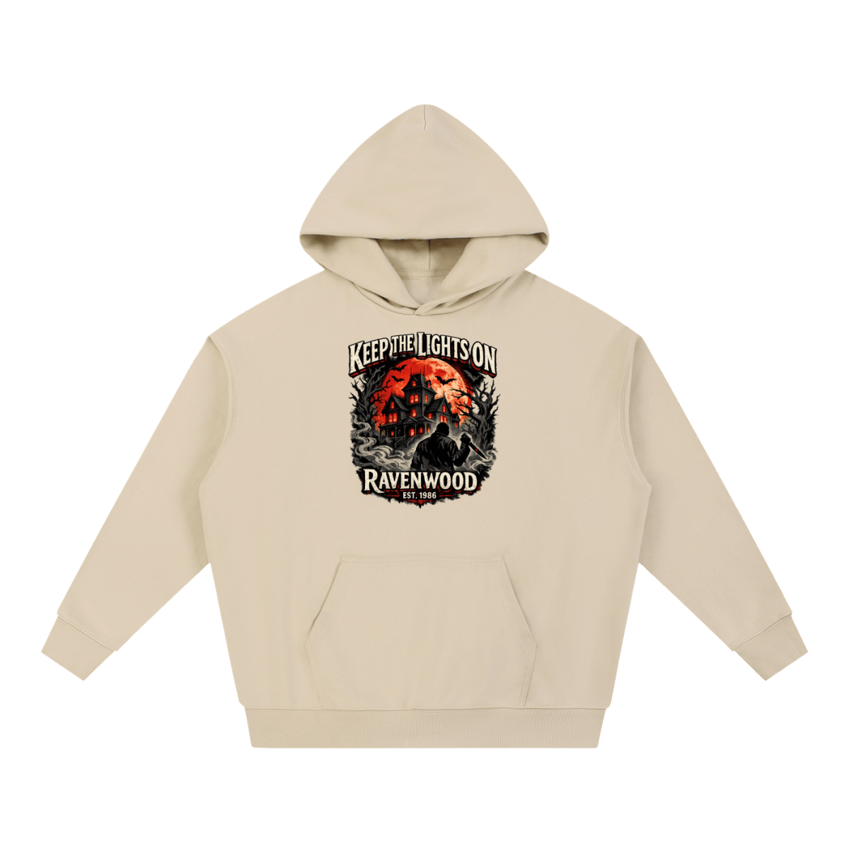 Sand heavyweight hoodie, front view with a haunted house, orange moon and knife-holding silhouette with Keep the Lights On and Ravenwood Est. 1986 lettering.