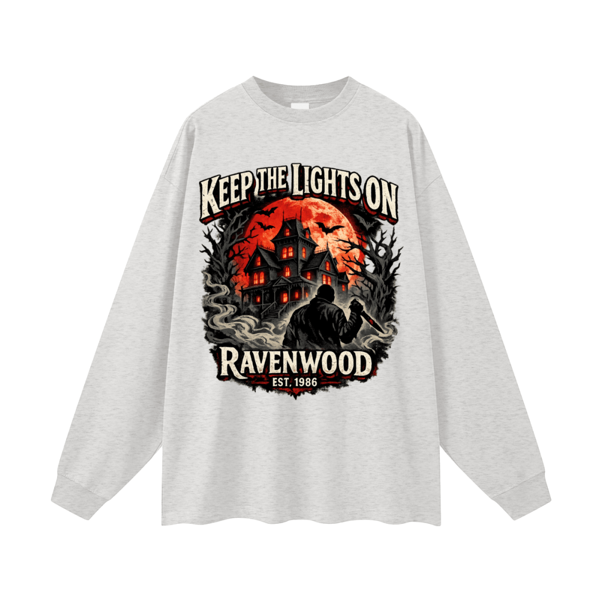 Heather gray oversized long-sleeve T-shirt, front view with a haunted house, orange moon and knife-holding silhouette with Keep the Lights On and Ravenwood Est. 1986 lettering.