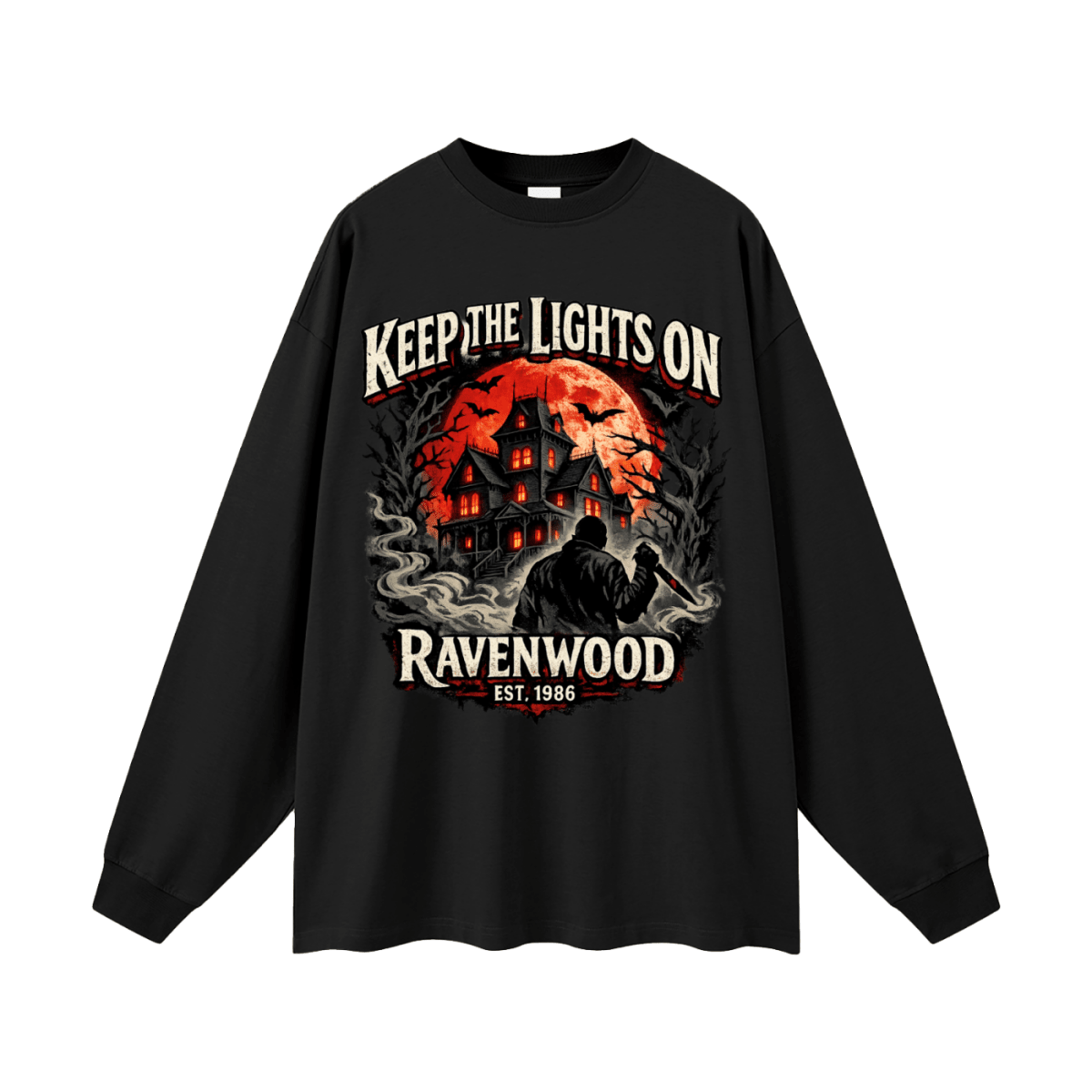 Black oversized long-sleeve T-shirt, front view with a haunted house, orange moon and knife-holding silhouette with Keep the Lights On and Ravenwood Est. 1986 lettering.
