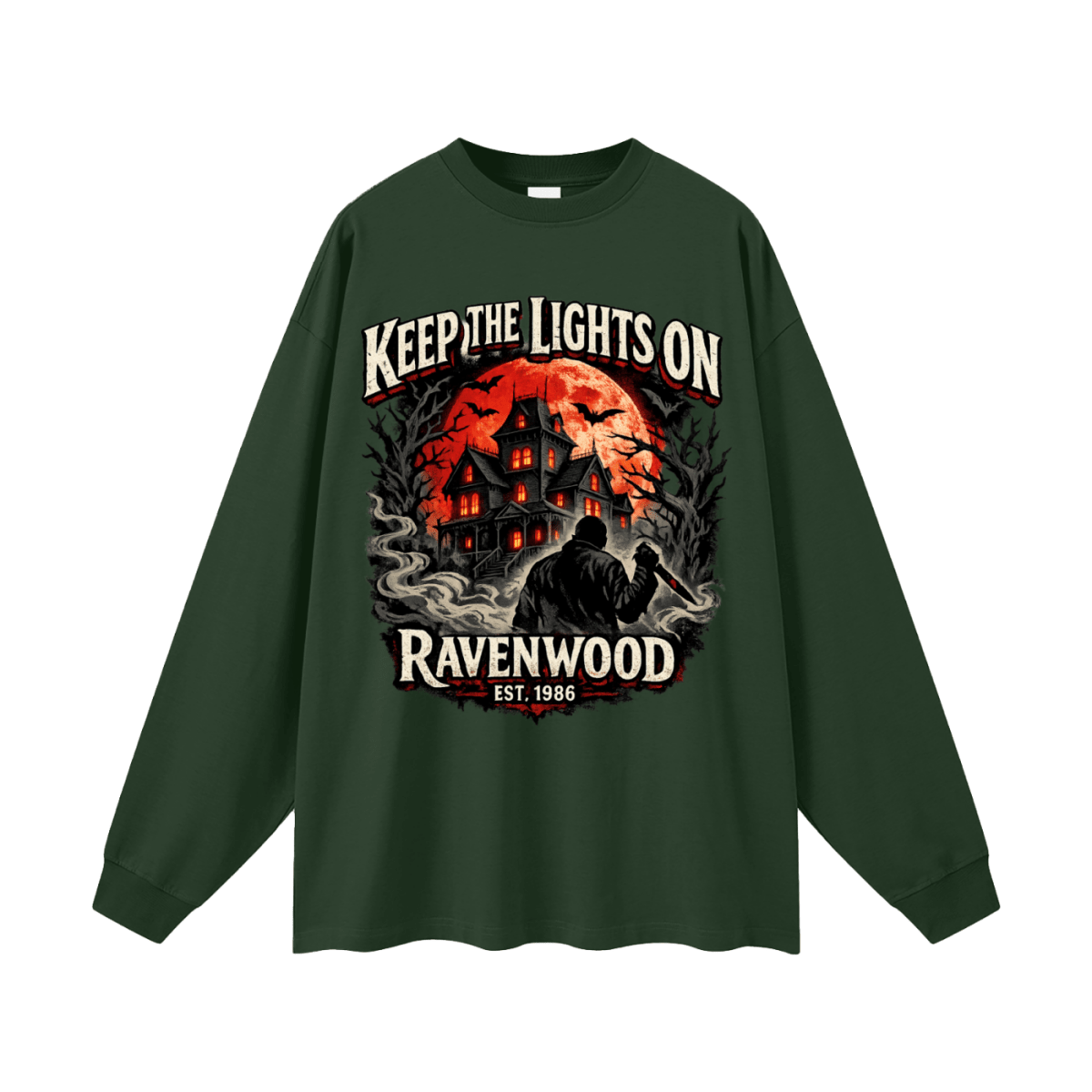 Forest green oversized long-sleeve T-shirt, front view with a haunted house, orange moon and knife-holding silhouette with Keep the Lights On and Ravenwood Est. 1986 lettering.