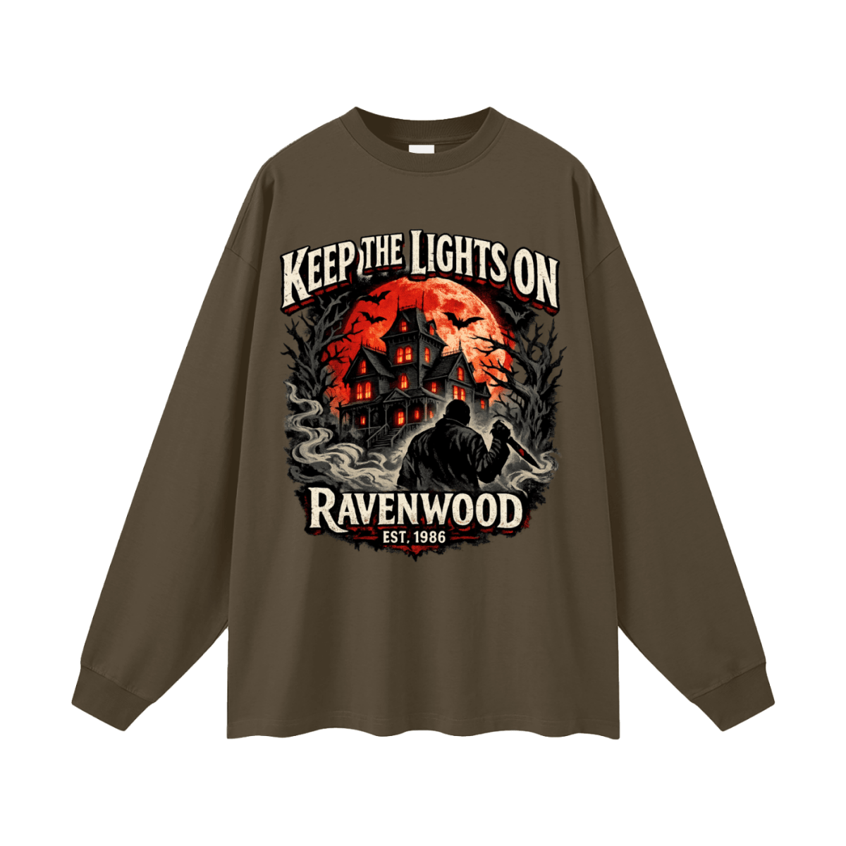 Dark brown oversized long-sleeve T-shirt, front view with a haunted house, orange moon and knife-holding silhouette with Keep the Lights On and Ravenwood Est. 1986 lettering.