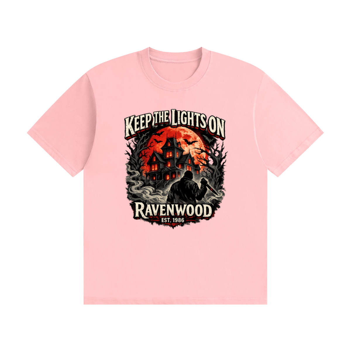 Pink cotton T-shirt, front view with a haunted house, orange moon and knife-holding silhouette with Keep the Lights On and Ravenwood Est. 1986 lettering.