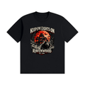 Black cotton T-shirt, front view with a haunted house, orange moon and knife-holding silhouette with Keep the Lights On and Ravenwood Est. 1986 lettering.