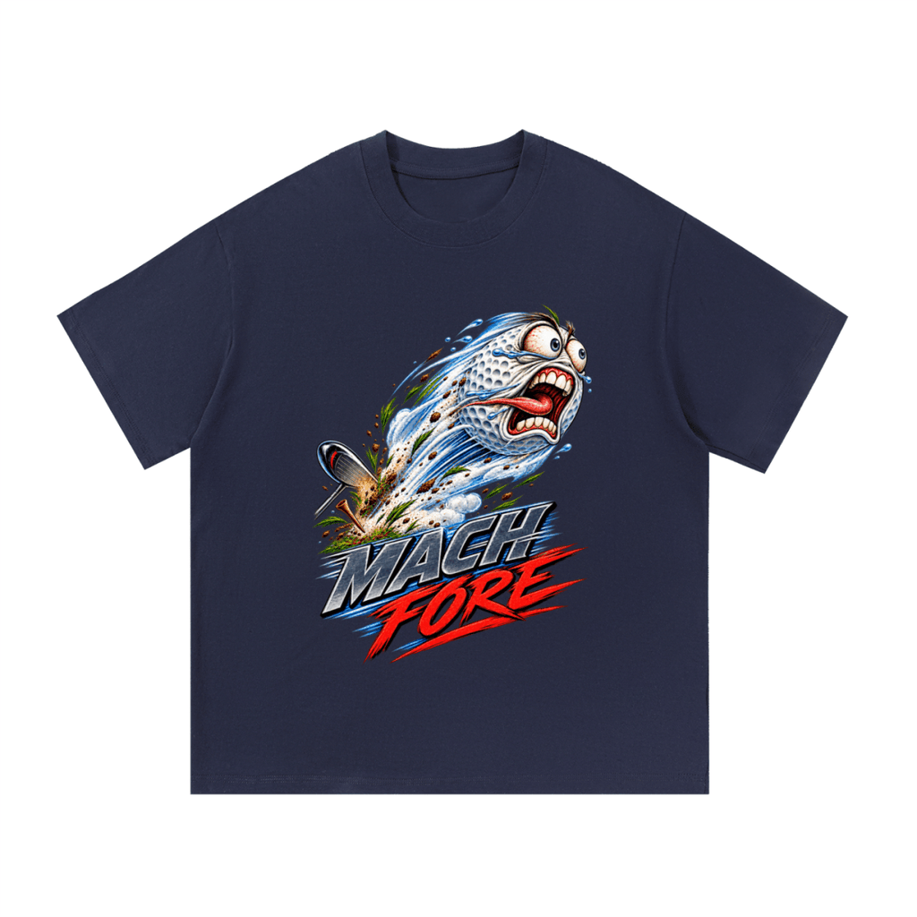 Navy blue Mach Fore T-shirt, front view with a screaming cartoon golf ball with blue motion streaks and red and gray lettering.