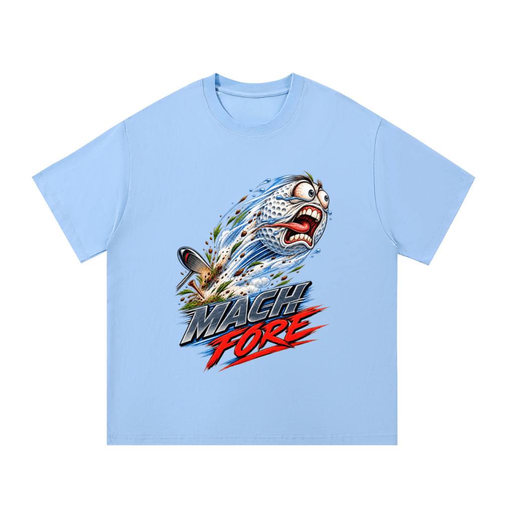 Light blue Mach Fore T-shirt, front view with a screaming cartoon golf ball with blue motion streaks and red and gray lettering.