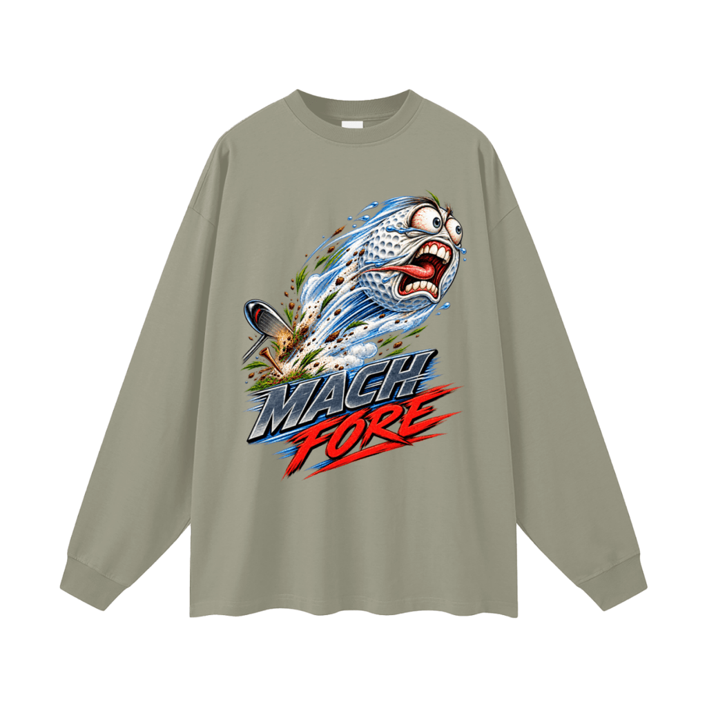 Sage green Mach Fore long-sleeve T-shirt, front view with a screaming cartoon golf ball with blue motion streaks and red and gray lettering.