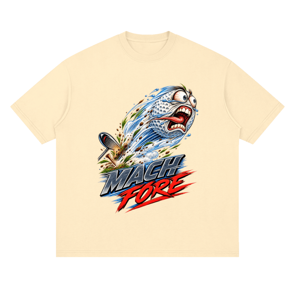 Pale yellow Mach Fore drop-shoulder T-shirt, front view with a screaming cartoon golf ball with blue motion streaks and red and gray lettering.