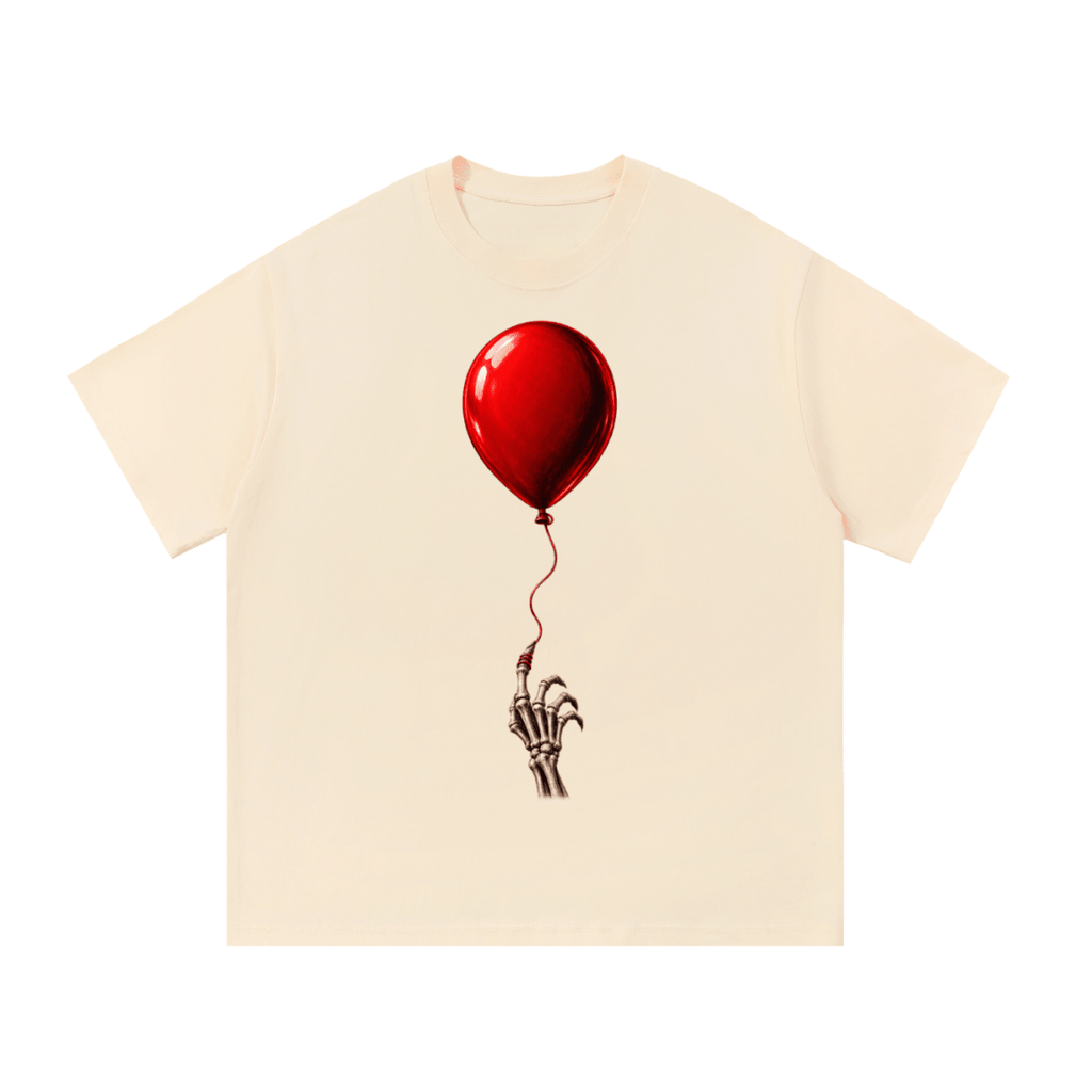 Cream The Last Balloon cotton T-shirt, front view with a shiny red balloon tethered to a skeletal hand.