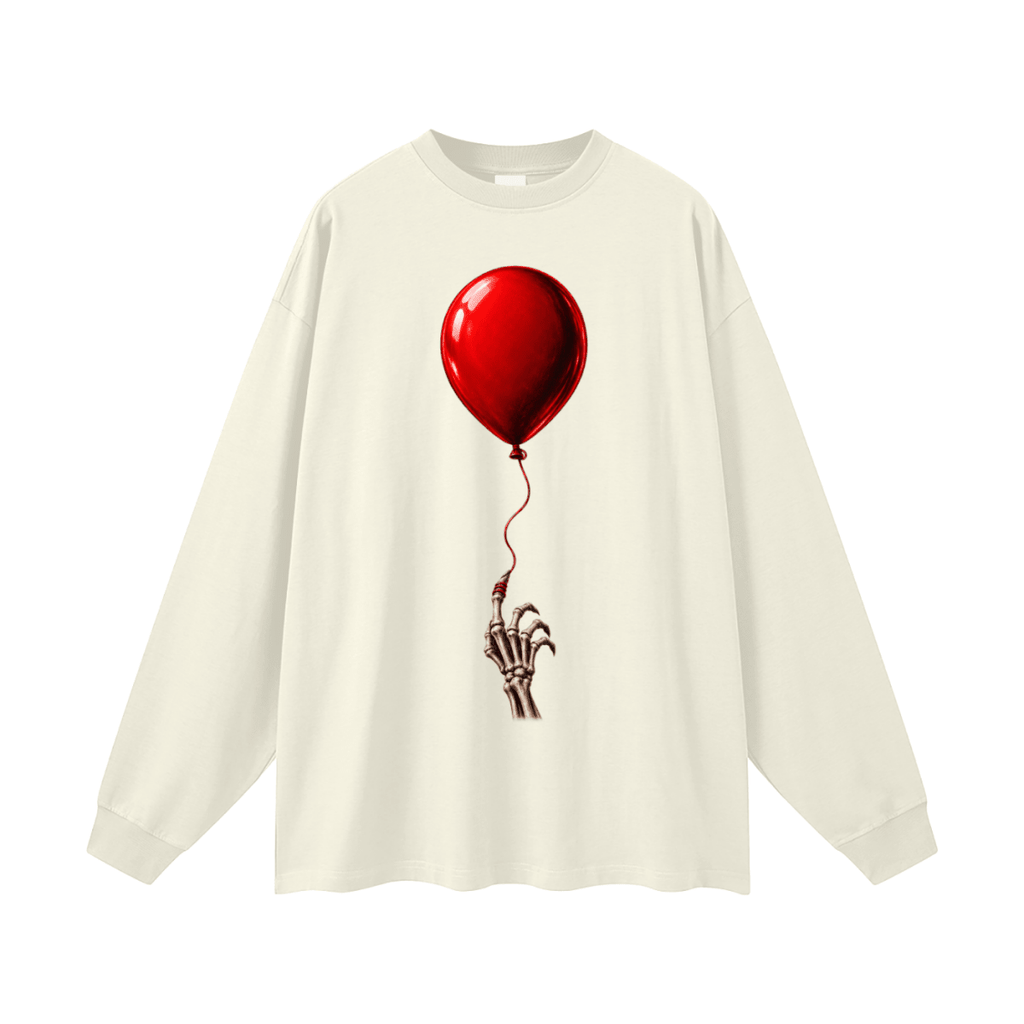 Ivory The Last Balloon oversized long sleeve T-shirt, front view with a shiny red balloon tethered to a skeletal hand.