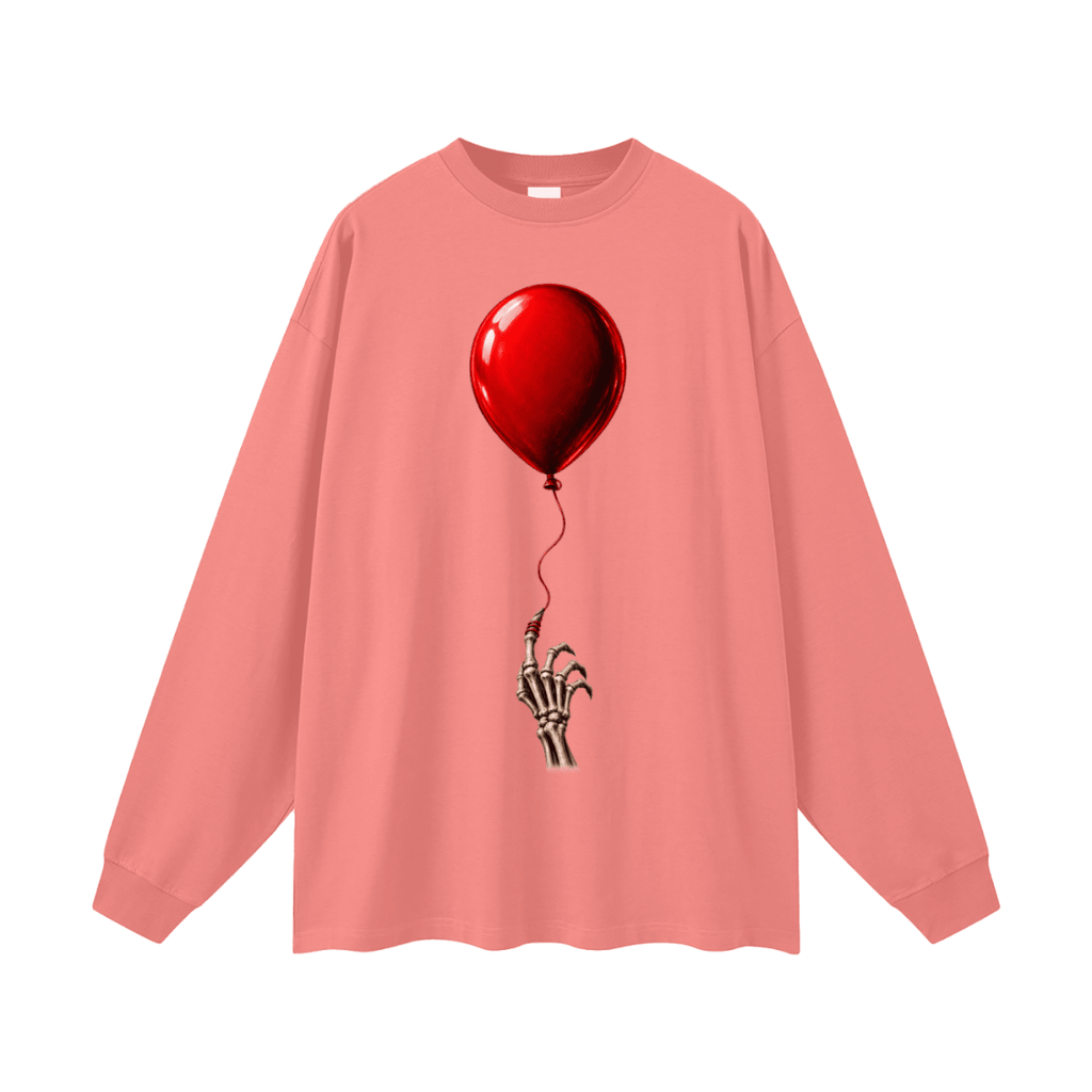 Coral pink The Last Balloon oversized long sleeve T-shirt, front view with a shiny red balloon tethered to a skeletal hand.