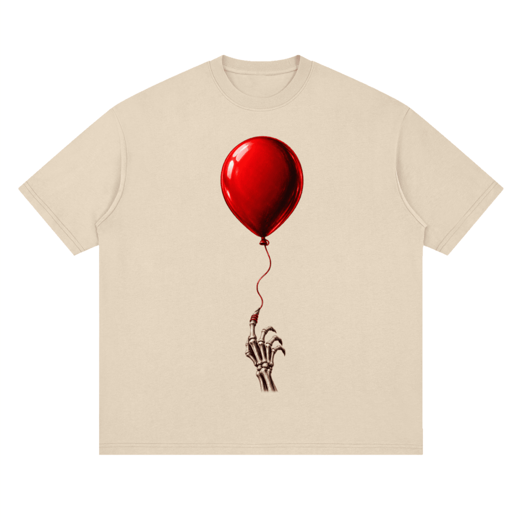 Cream The Last Balloon drop shoulder T-shirt, front view with a shiny red balloon tethered to a skeletal hand.