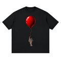 Black The Last Balloon drop shoulder T-shirt, front view with a shiny red balloon tethered to a skeletal hand.