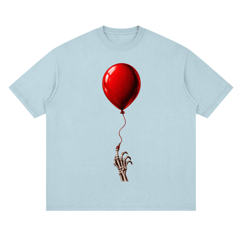 Pale blue The Last Balloon drop shoulder T-shirt, front view with a shiny red balloon tethered to a skeletal hand.