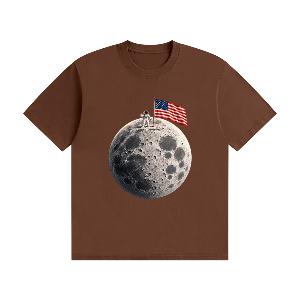 Brown cotton T-shirt, front view with an astronaut and American flag on a cratered moon.