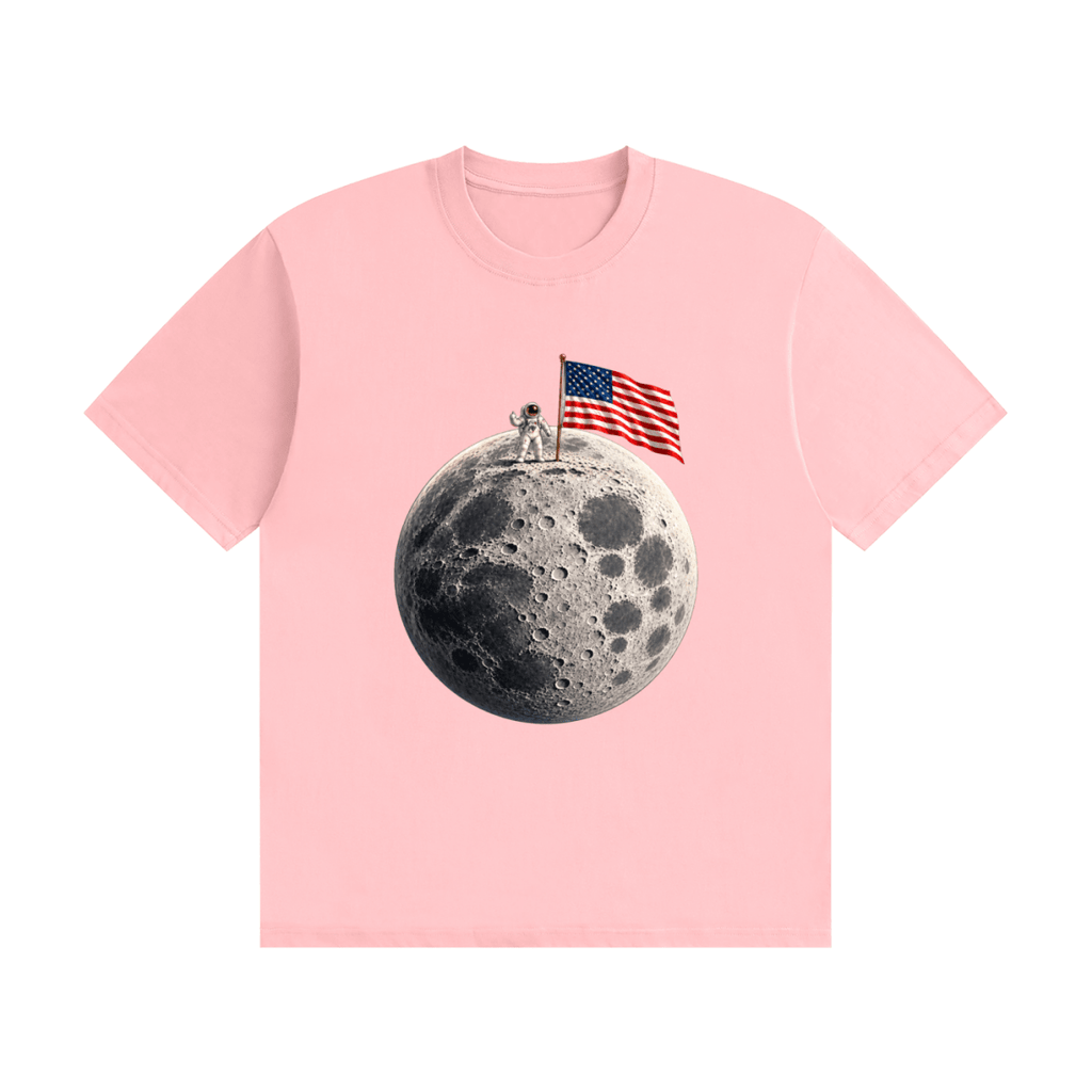 Pink cotton T-shirt, front view with an astronaut and American flag on a cratered moon.