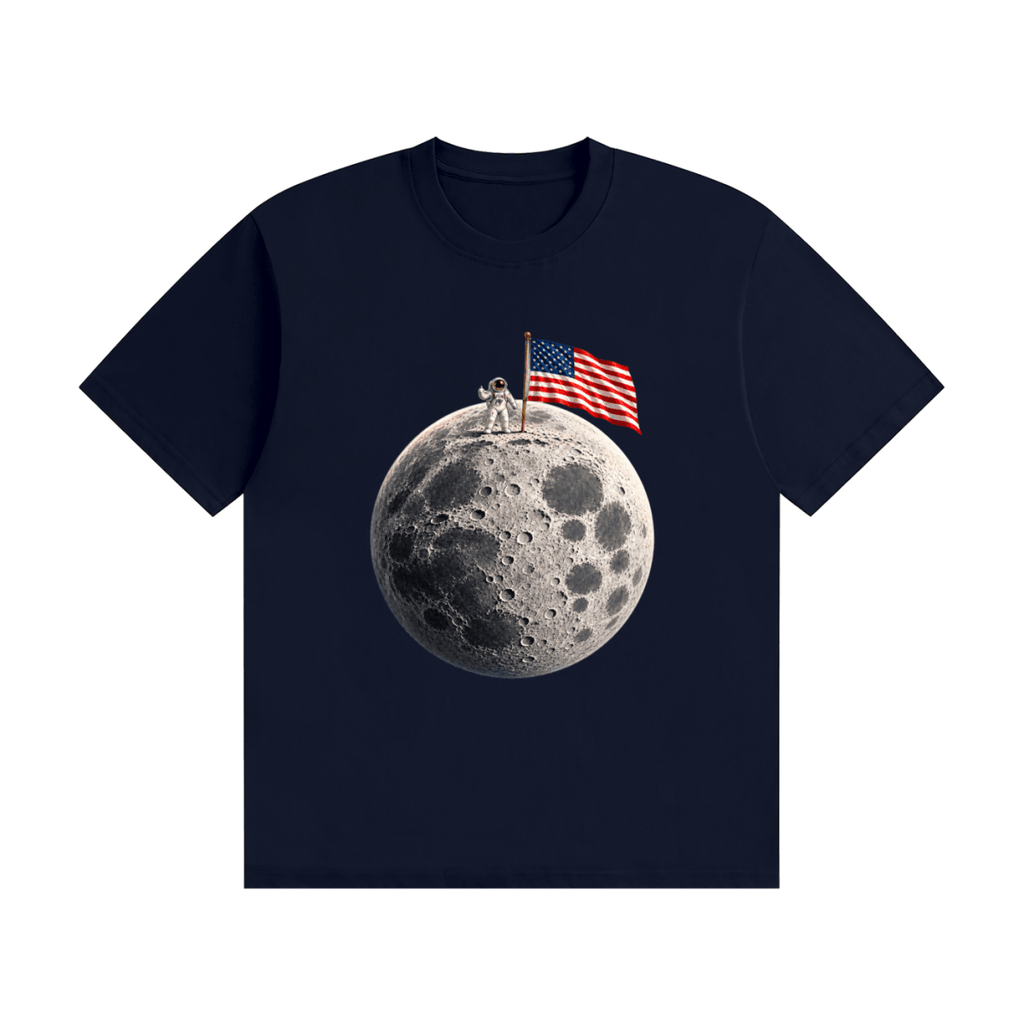 Navy blue cotton T-shirt, front view with an astronaut and American flag on a cratered moon.